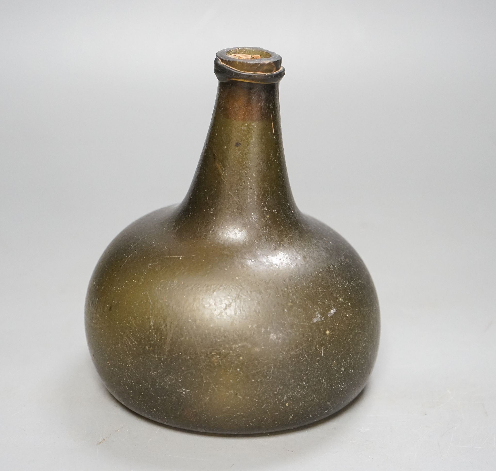 Early 18th century Dutch olive green glass onion shaped bottle, 16cm